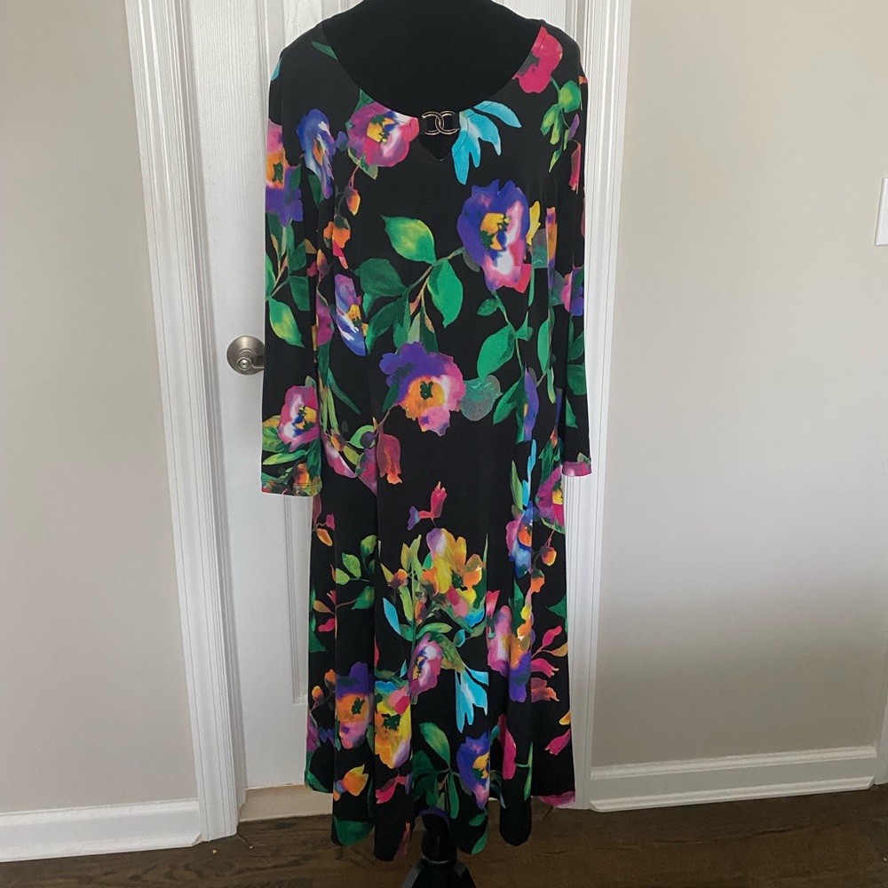 Susan Graver Liquid knit multi floral on black background.